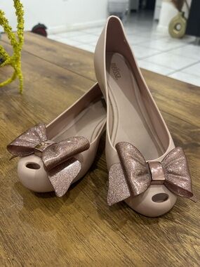 Melissa peep toe bow flats.